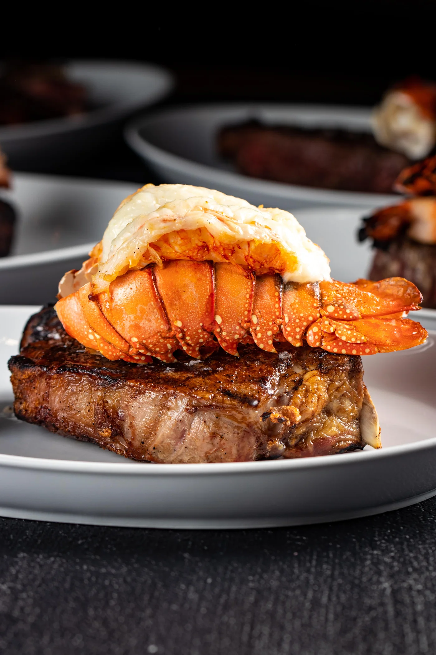 Surf and turf at STK Niagara Falls, butter-poached lobster tail atop a filet mignon