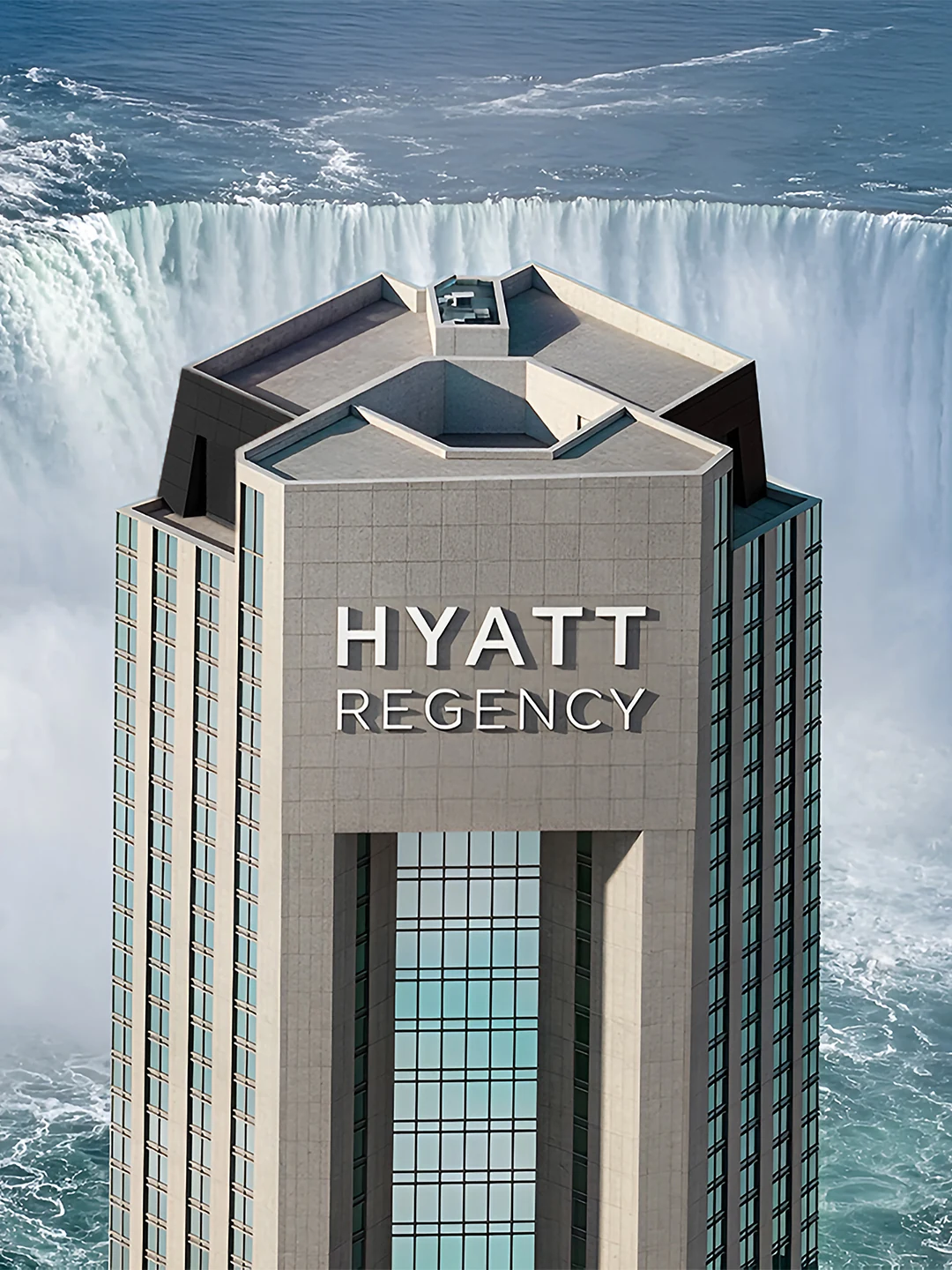 Vertical portrait of the Hyatt Regency Fallsview tower rising against the mist and cascading water of the Horseshoe Falls